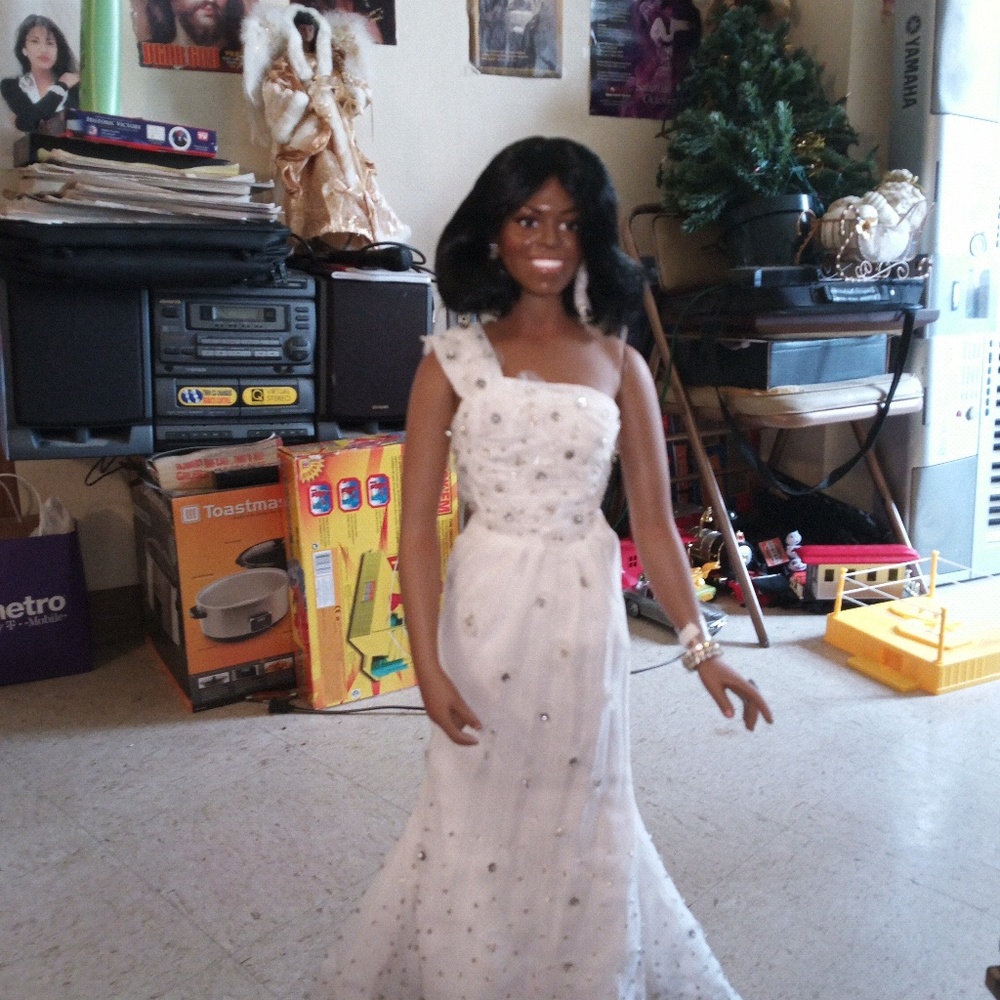 I'm selling The Michelle Obama porcelain doll this